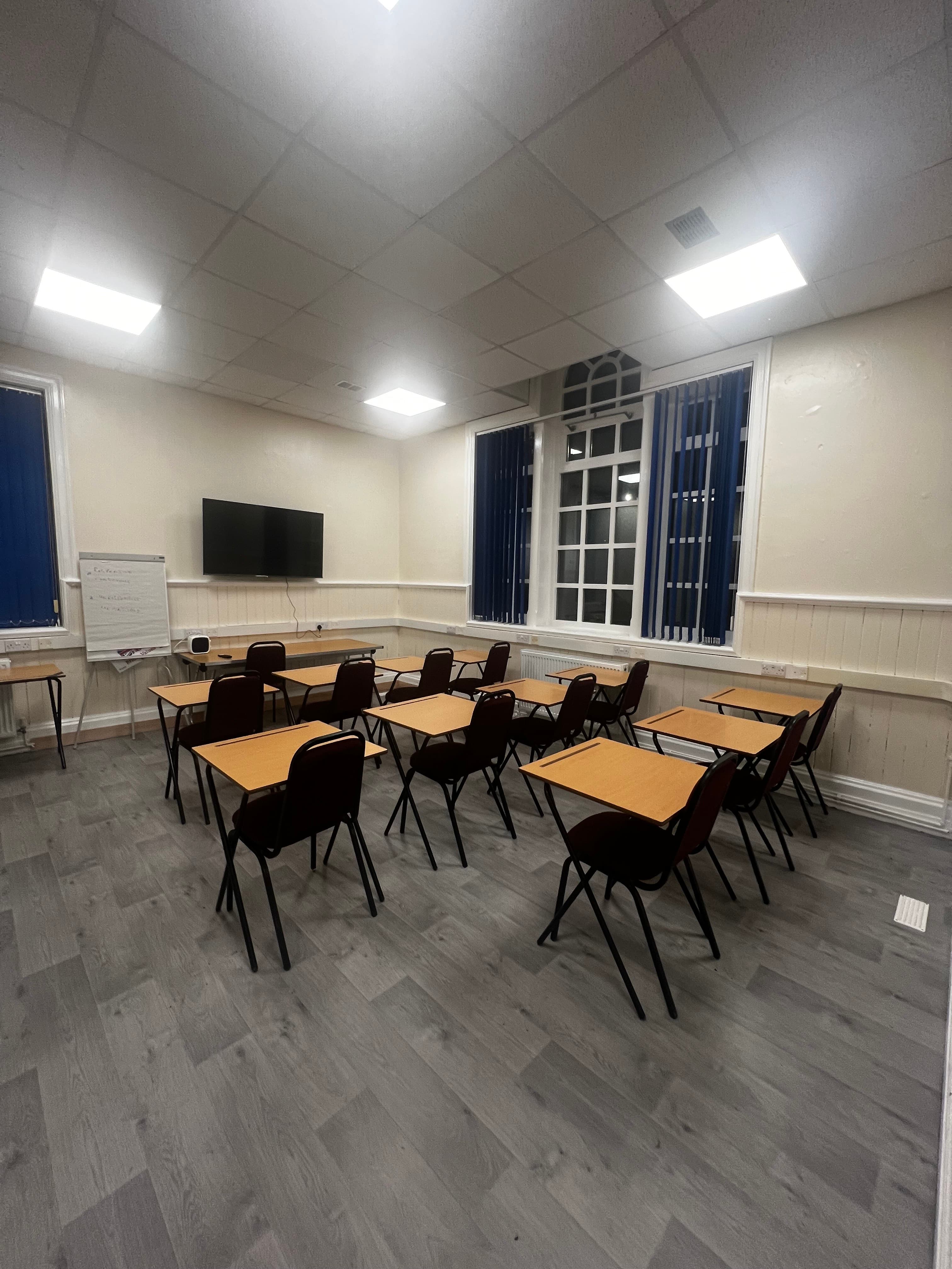 Meeting room with tables and chairs at Crook Community Centre